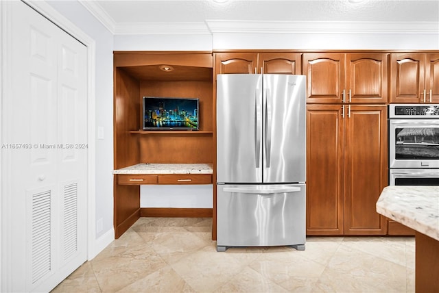 kitchen featuring brown cabinets, marble finish floor, light stone countertops, crown molding, and appliances with stainless steel finishes