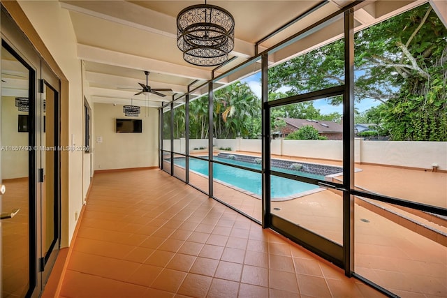 view of pool featuring ceiling fan with notable chandelier