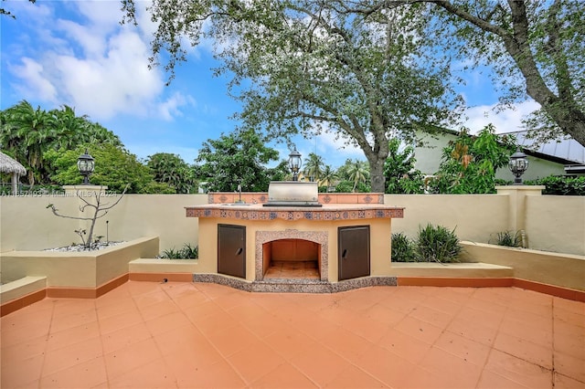 view of patio / terrace with a grill, a sink, and area for grilling