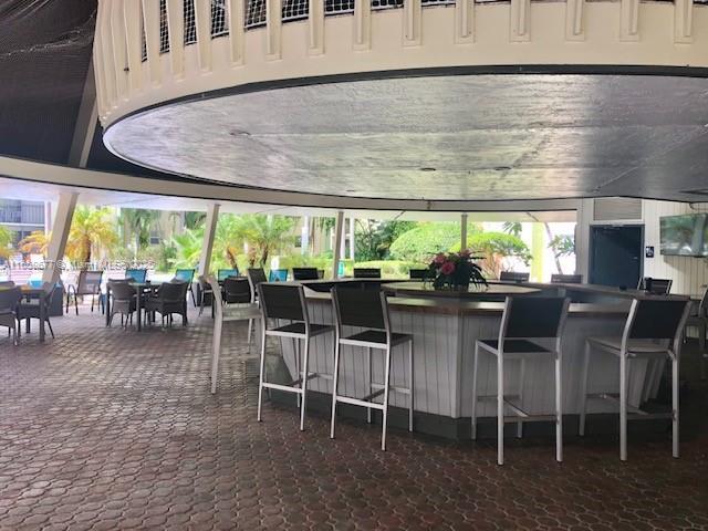 view of patio with a bar