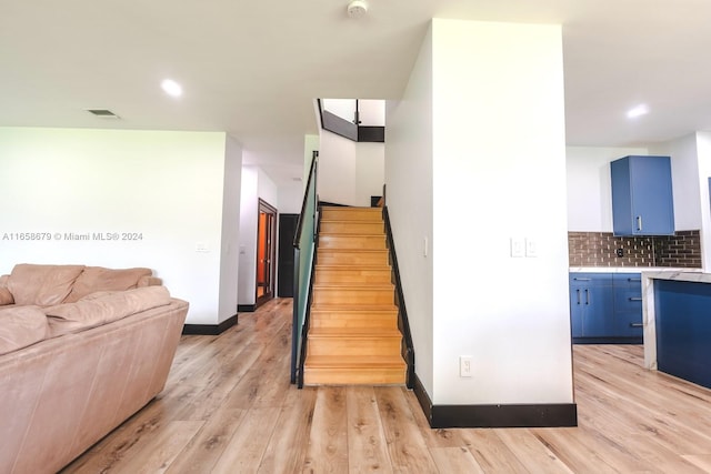 stairway featuring hardwood / wood-style floors