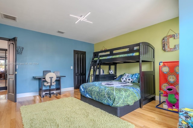 bedroom featuring wood-type flooring