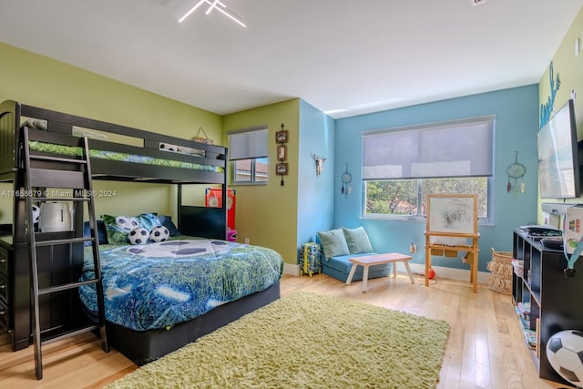 bedroom with hardwood / wood-style floors