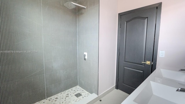 bathroom with a tile shower