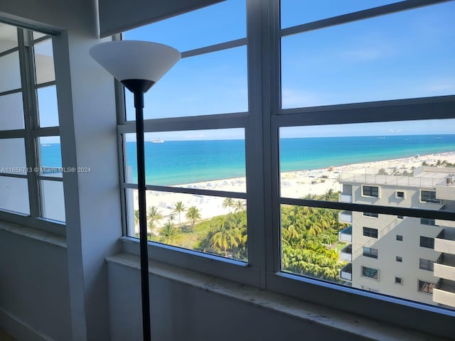 interior details with a water view and a beach view