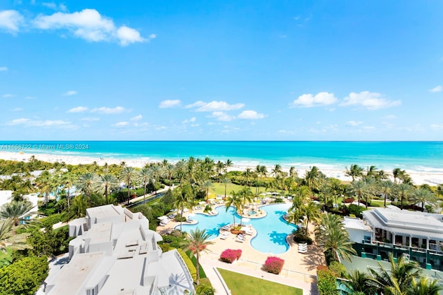 drone / aerial view with a view of the beach and a water view