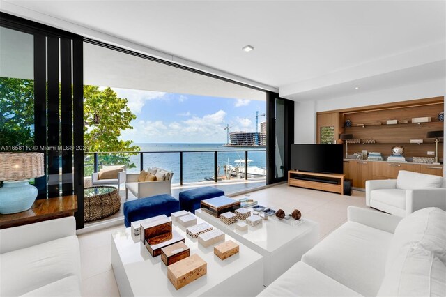 living room featuring light tile patterned floors and expansive windows