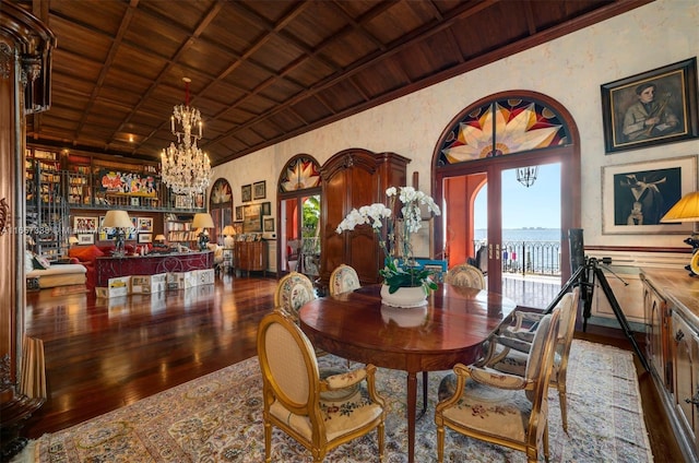 dining room with a water view, a healthy amount of sunlight, hardwood / wood-style floors, and wooden ceiling