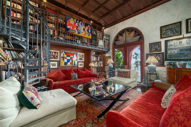 living room with wooden ceiling, french doors, and beam ceiling