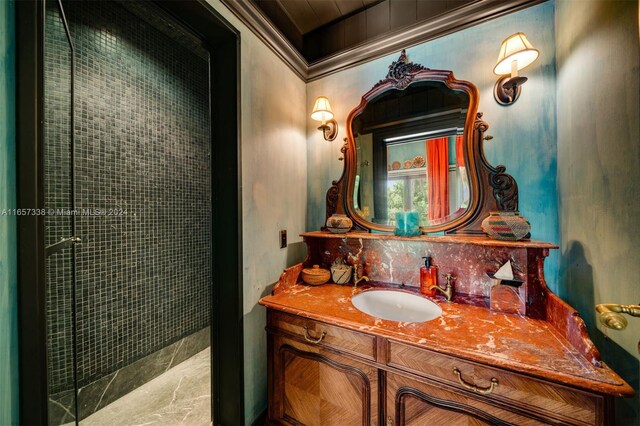 bathroom featuring vanity and an enclosed shower