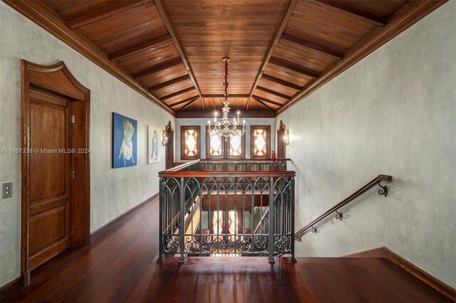 staircase with lofted ceiling, wood-type flooring, a chandelier, and wooden ceiling