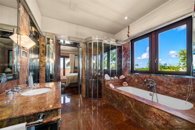 bathroom featuring vanity and plus walk in shower