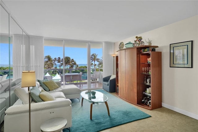 tiled living room featuring a wealth of natural light and expansive windows