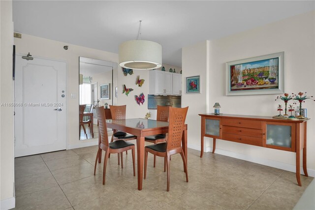 dining space with light tile patterned floors