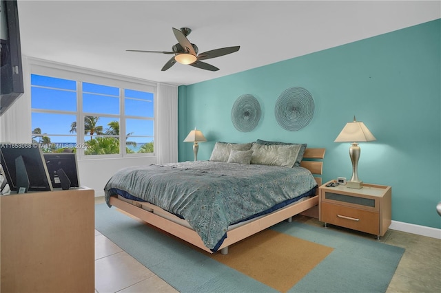 bedroom featuring ceiling fan and tile patterned floors