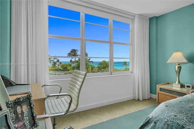 bedroom featuring a water view