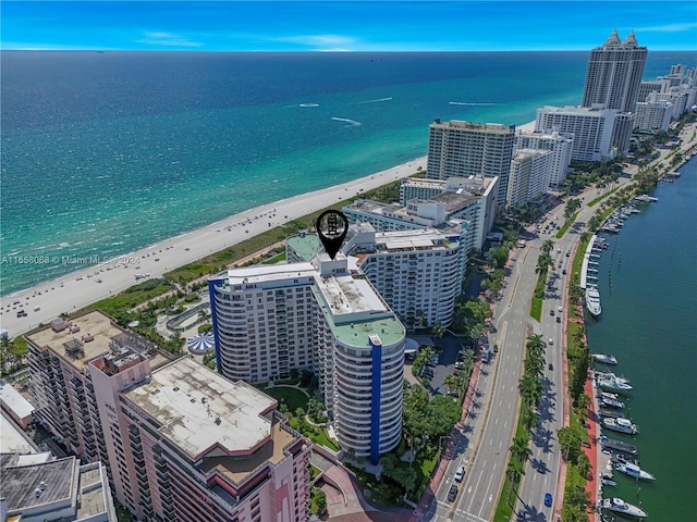 bird's eye view featuring a view of the beach and a water view