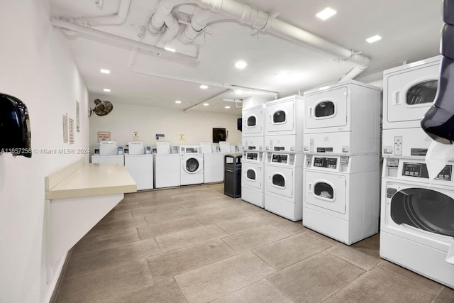 washroom featuring stacked washer / dryer and washer and clothes dryer