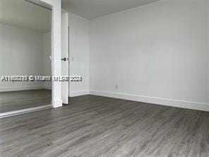 13499 Biscayne Blvd Unit 801, North Miami, FL 33181 - unfurnished bedroom with wood finished floors and baseboards