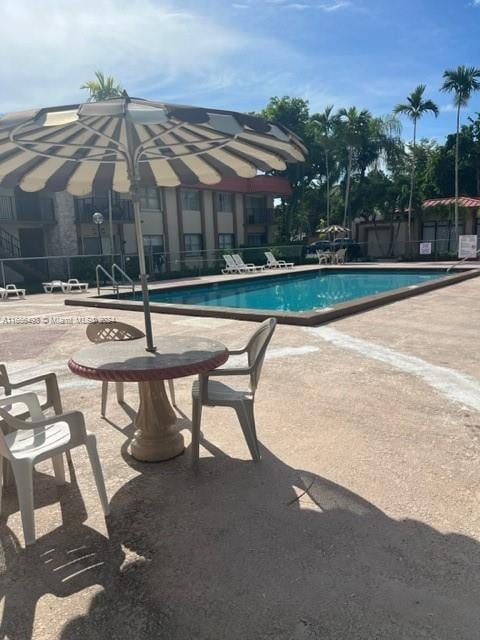 10411 SW 108th Ave Unit 153, Miami, FL 33176 - community pool featuring a patio area