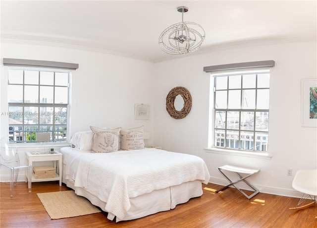 bedroom with hardwood / wood-style floors