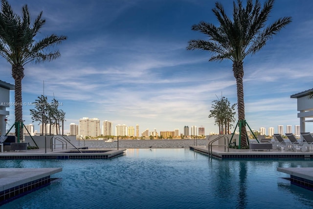 view of pool featuring a water view