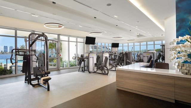 workout area with plenty of natural light and concrete floors