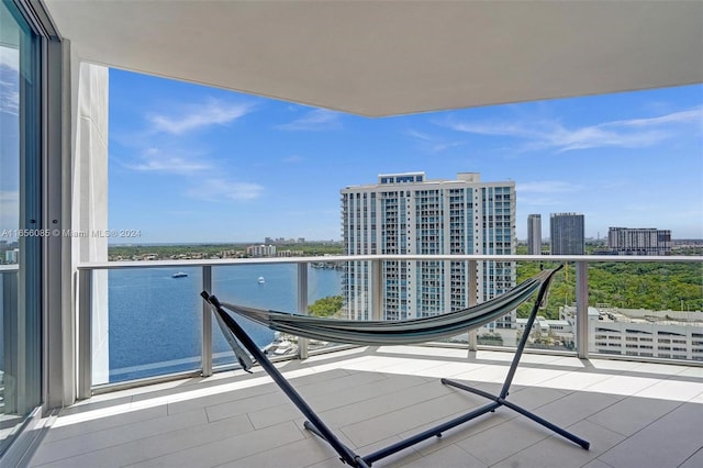 balcony featuring a water view