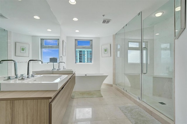 bathroom featuring vanity, separate shower and tub, and tile patterned floors