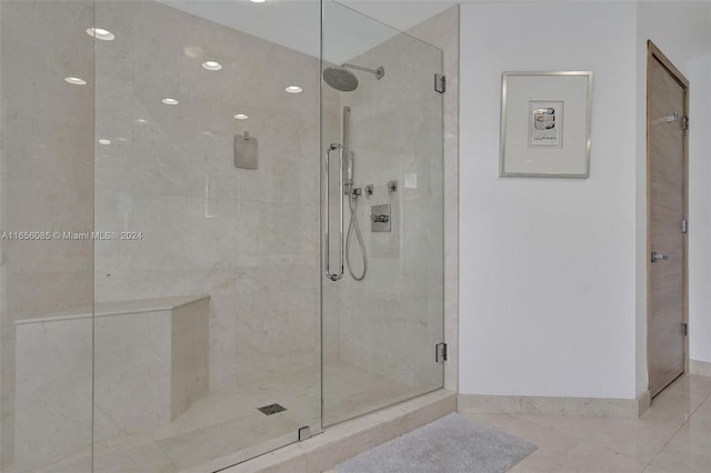 bathroom featuring walk in shower and tile patterned floors