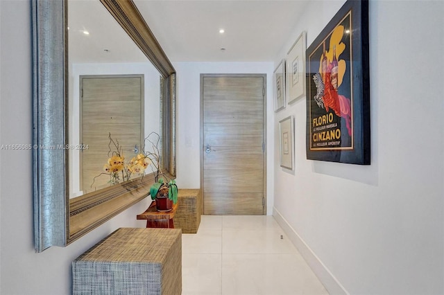 hallway featuring light tile patterned flooring