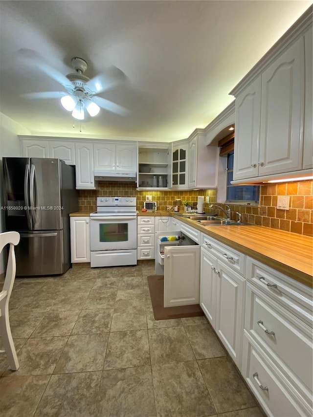 kitchen with backsplash, electric range, stainless steel fridge, wooden counters, and ceiling fan