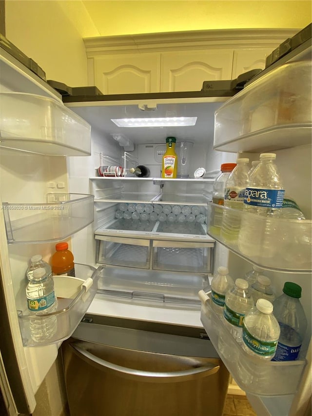 interior details with stainless steel refrigerator