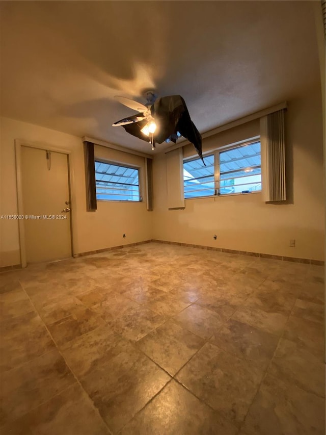 spare room featuring ceiling fan