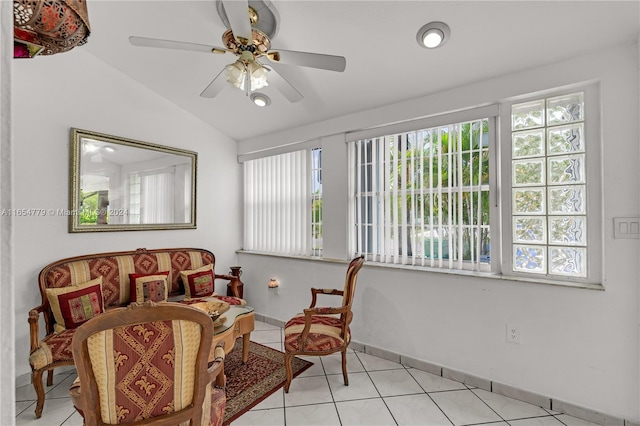 sitting room featuring ceiling fan, vaulted ceiling, and light tile patterned flooring