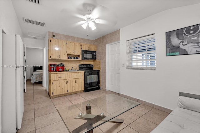 kitchen with light tile patterned floors, black appliances, ceiling fan, and light brown cabinets