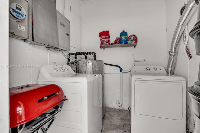 laundry room with electric panel and separate washer and dryer