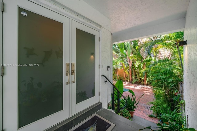 view of exterior entry featuring french doors