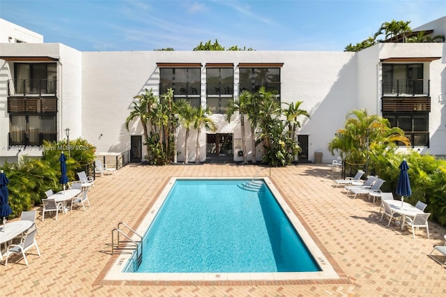 view of pool featuring a patio