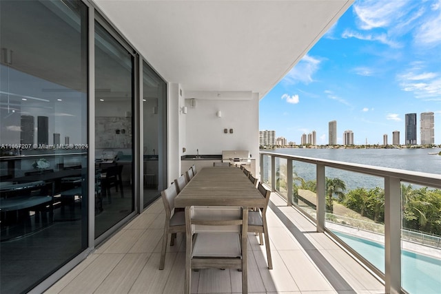 balcony featuring a water view