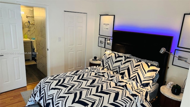 bedroom with wood-type flooring and ensuite bathroom