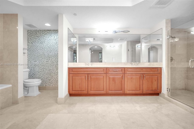 bathroom with vanity, toilet, and an enclosed shower