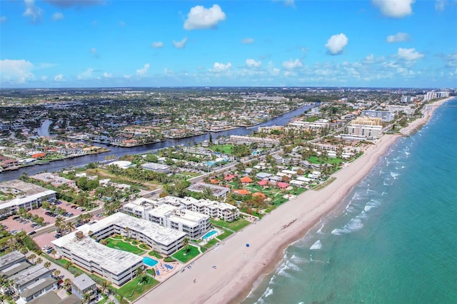 birds eye view of property with a view of the beach and a water view