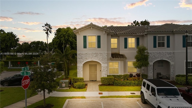 mediterranean / spanish-style house featuring a yard