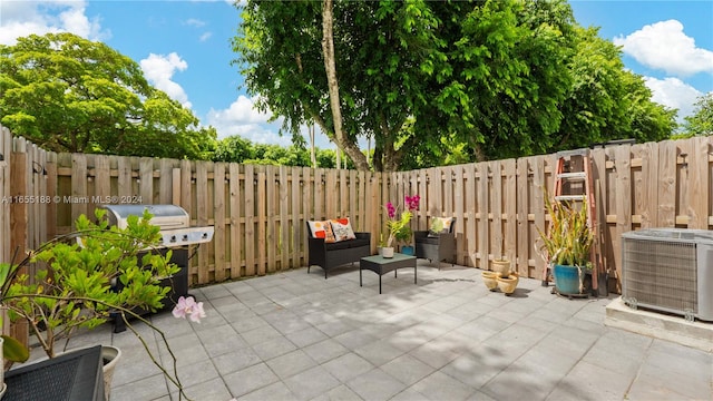 view of patio with central AC unit and grilling area