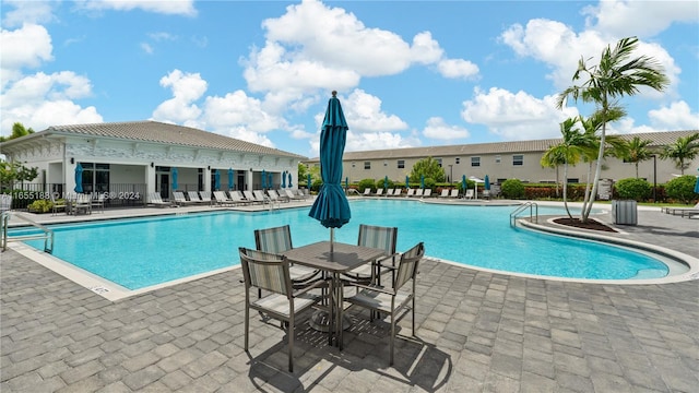 view of swimming pool with a patio