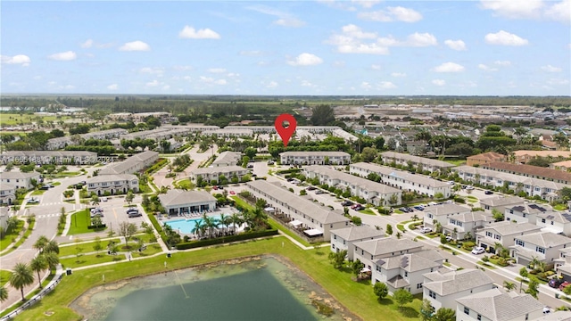 birds eye view of property featuring a water view