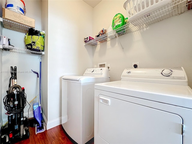 laundry room featuring separate washer and dryer and dark hardwood / wood-style floors