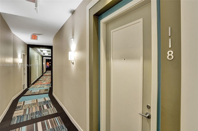 hallway with carpet flooring