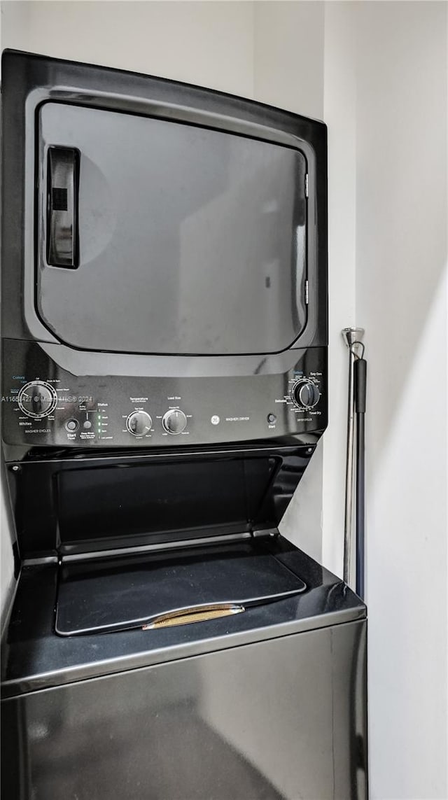 laundry room featuring stacked washing maching and dryer